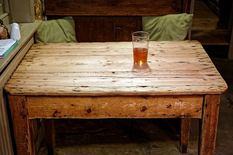 A Wooden Table With Scratches and Water Rings A Wooden Table With Scratches and Water Rings