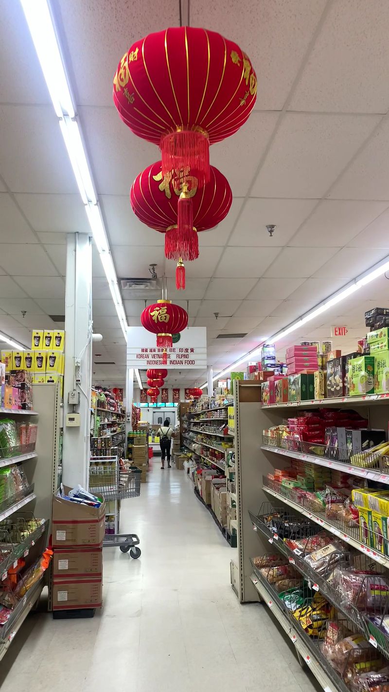 Aisles Stacked with Sauces, Noodles, and Rice