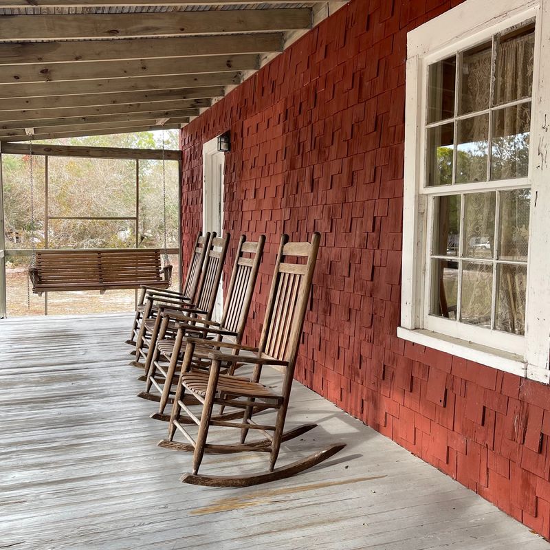 An Island Museum With Rocking Chairs Out Front An Island Museum With Rocking Chairs Out Front