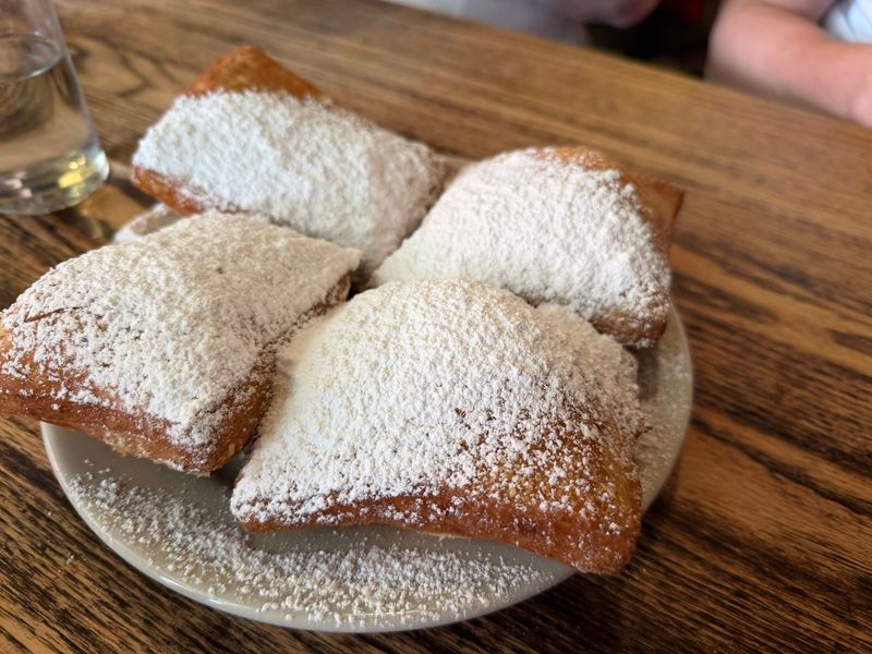 Beignets With Powdered Sugar Everywhere