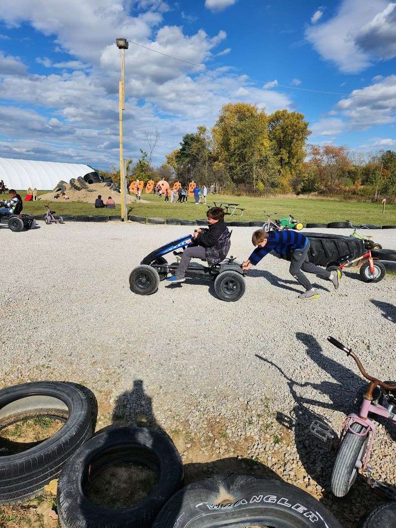 Bounce Pads, Pedal Tractors, and a Corn Pit Bounce Pads, Pedal Tractors, and a Corn Pit