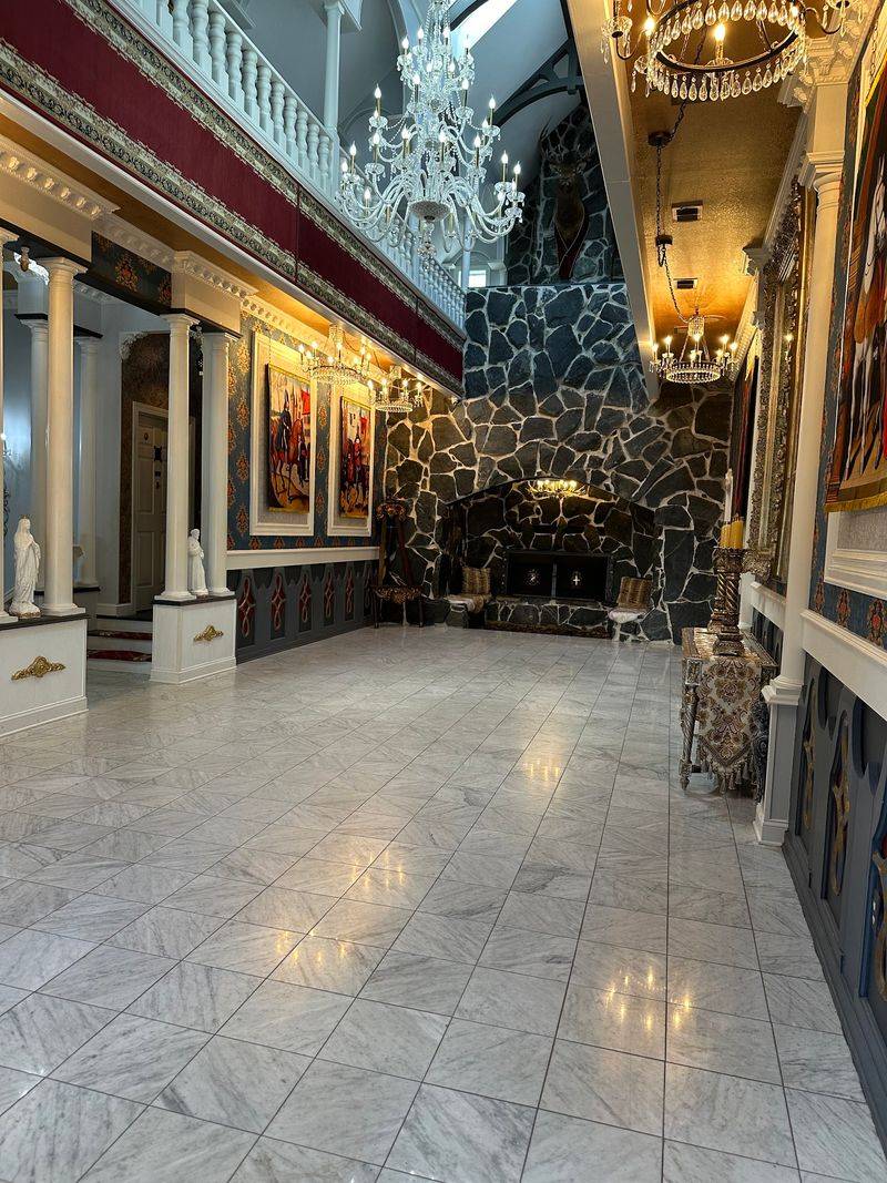Carved Wood, Stone Walls, and Dinosaur Chandeliers Carved Wood, Stone Walls, and Dinosaur Chandeliers