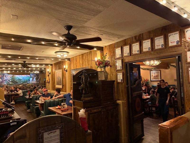Cowboy Murals and Wood-Paneled Walls