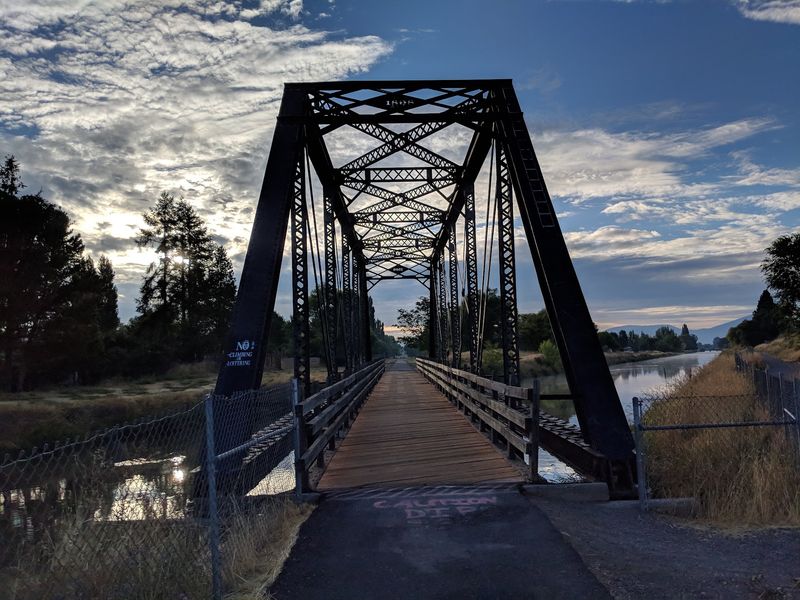 Crossing the Old Railroad Bridge Over the Canal