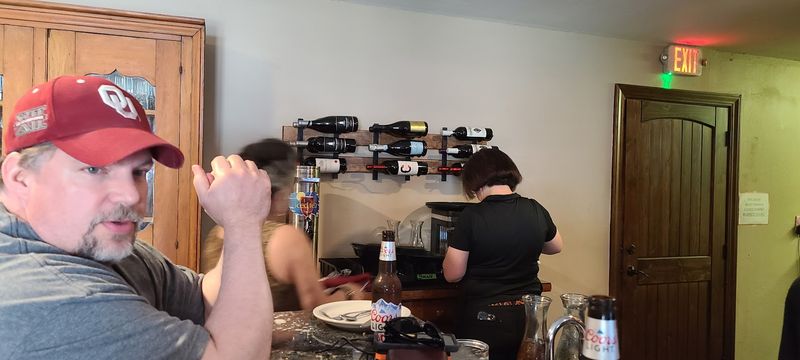 Family Hands Behind the Grill