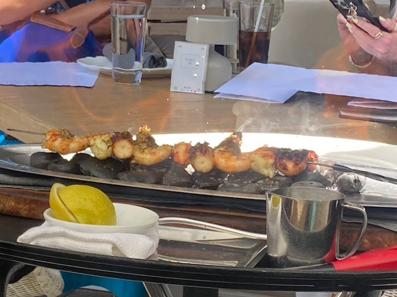 Flames at the Table With the Mixed Seafood Grill