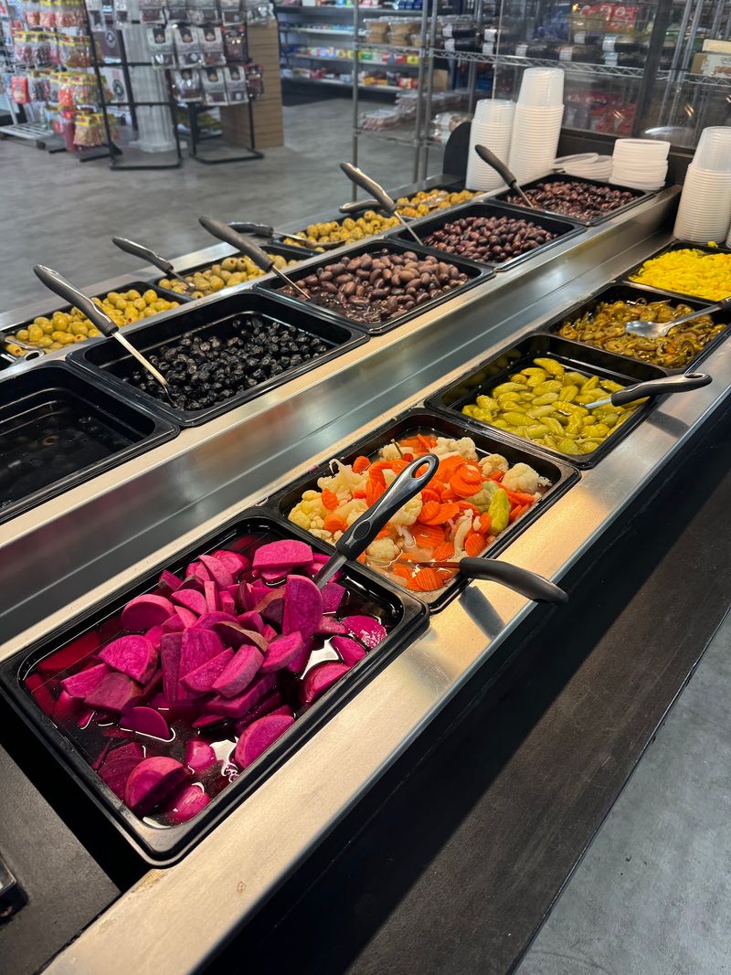 Olives, Peppers, and Salads Behind the Glass Olives, Peppers, and Salads Behind the Glass