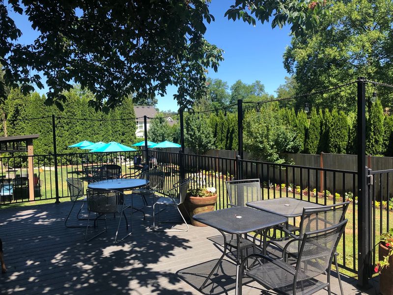 Porch, Deck, and a Lawn Made for Lingering