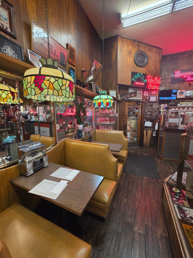 Red Booths, Tableside Jukeboxes, and a Cozy Squeeze Red Booths, Tableside Jukeboxes, and a Cozy Squeeze