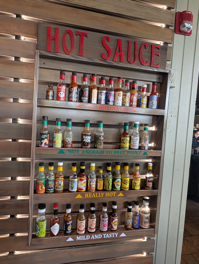 Sauce Bottles and a Hot Sauce Wall Sauce Bottles and a Hot Sauce Wall