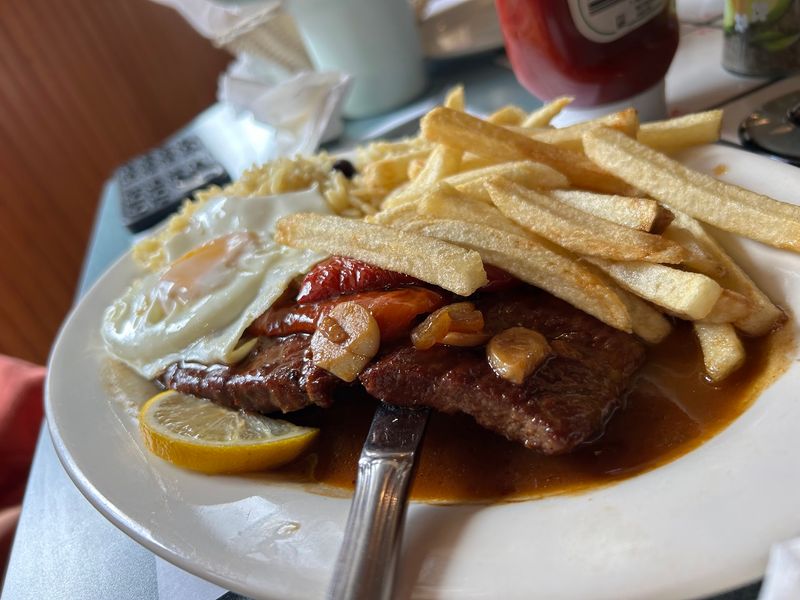 Steaks Topped With Red Peppers and Tradition