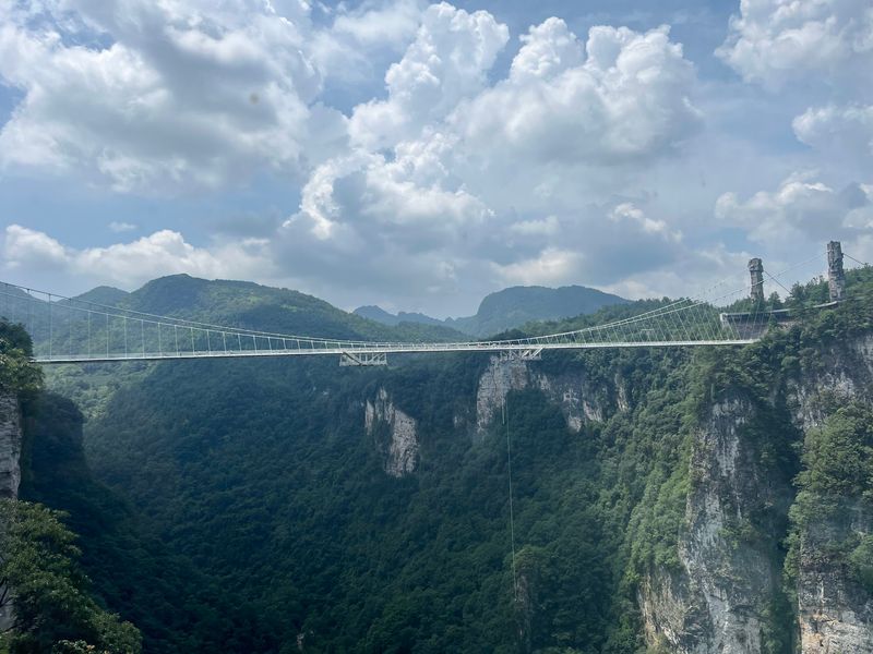 The Glass-Bottom Bridge Over Zhangjiajie Grand Canyon The Glass-Bottom Bridge Over Zhangjiajie Grand Canyon
