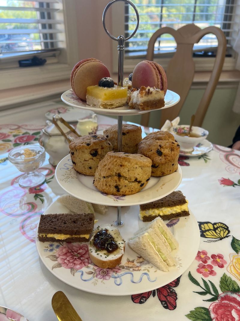 Three Tiers Of Sandwiches, Scones, And Real Clotted Cream Three Tiers Of Sandwiches, Scones, And Real Clotted Cream