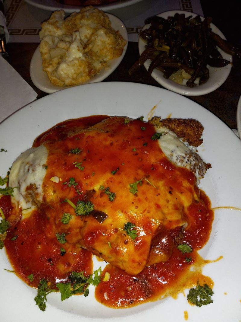 Veal Piccata and Ravioli at a Diner Table Veal Piccata and Ravioli at a Diner Table
