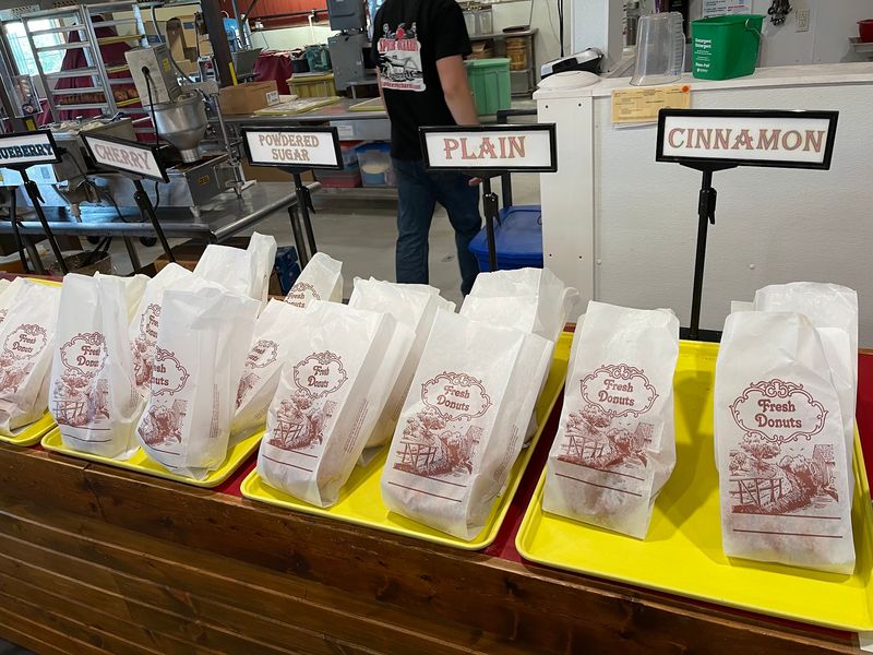 Warm Donuts Bagged Right Behind the Counter Warm Donuts Bagged Right Behind the Counter