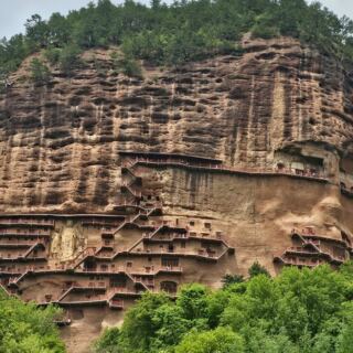 More Than 10,000 Buddhist Sculptures Hide Inside This Sheer Cliff in China