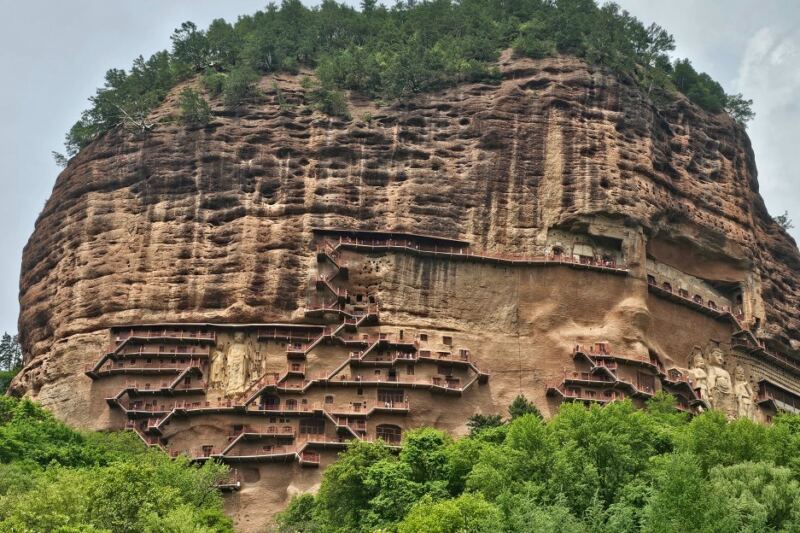 More Than 10,000 Buddhist Sculptures Hide Inside This Sheer Cliff in China