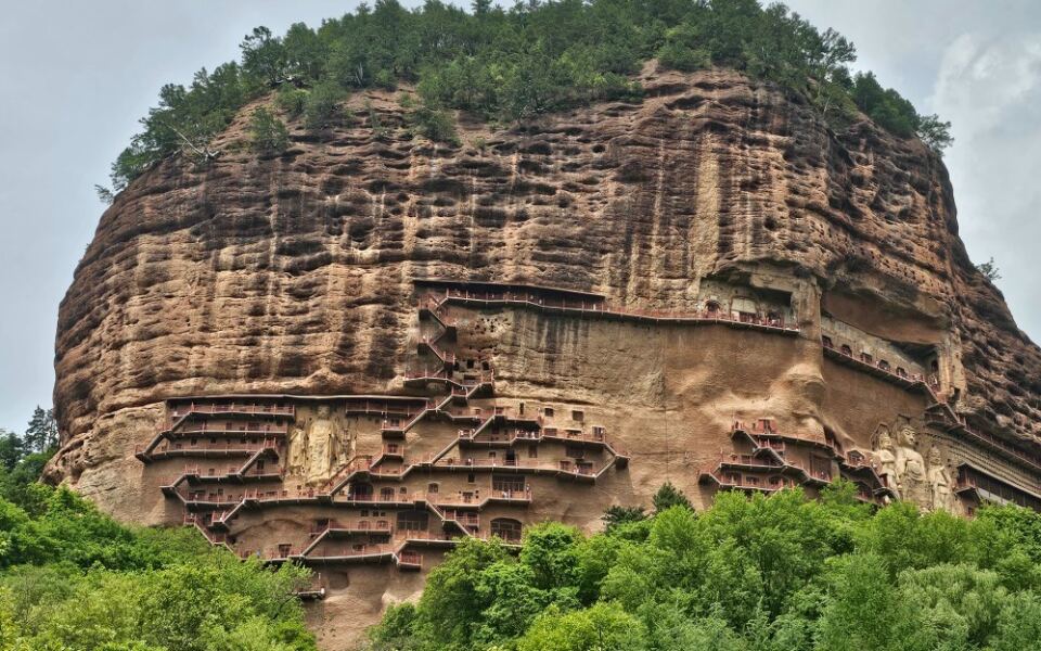 More Than 10,000 Buddhist Sculptures Hide Inside This Sheer Cliff in China