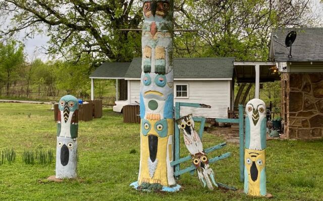 Totem Poles Painted Like Folk Art Rise From the Woods at Ed Galloway’s Park in Foyil