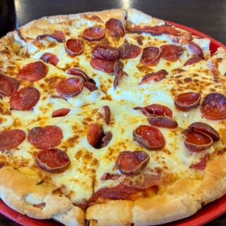 This Lenexa, Kansas, Pizza Spot Has Earned a Loyal Following for Loaded Pies and Local Flavor