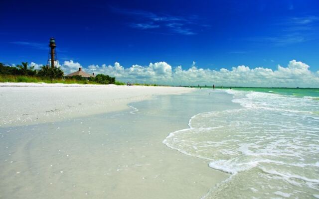Seashells Wash Up Beneath a Historic Lighthouse on This Turquoise Florida Beach Most Tourists Skip