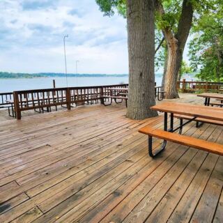 This Oklahoma Lake Retreat Rents Rustic Cabins and Boats With Free Breakfast on a Lakeside Deck