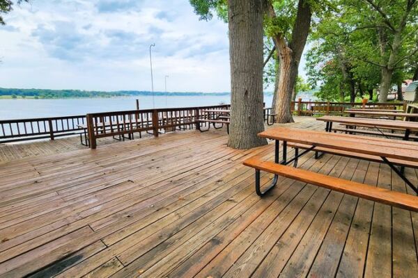 This Oklahoma Lake Retreat Rents Rustic Cabins and Boats With Free Breakfast on a Lakeside Deck