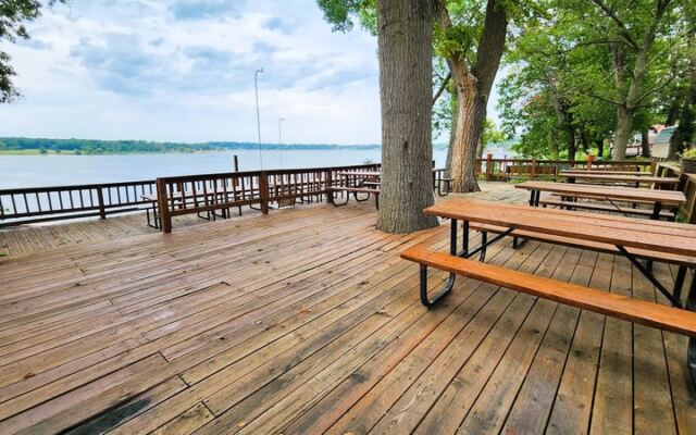 This Oklahoma Lake Retreat Rents Rustic Cabins and Boats With Free Breakfast on a Lakeside Deck