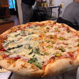 This Cash-Only Savannah, Georgia Pizza Joint Serves Giant Thin-Crust Slices Worth the Wait