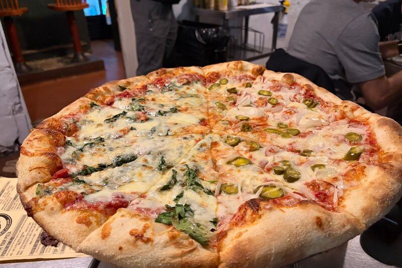 This Cash-Only Savannah, Georgia Pizza Joint Serves Giant Thin-Crust Slices Worth the Wait