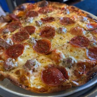Illinois Locals Have Sworn By This Historic Thin-Crust Pizzeria For Generations