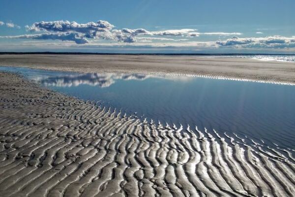 Low Tide Uncovers Bright Pale Sand at This Massachusetts Beach That Hardly Looks Like New England