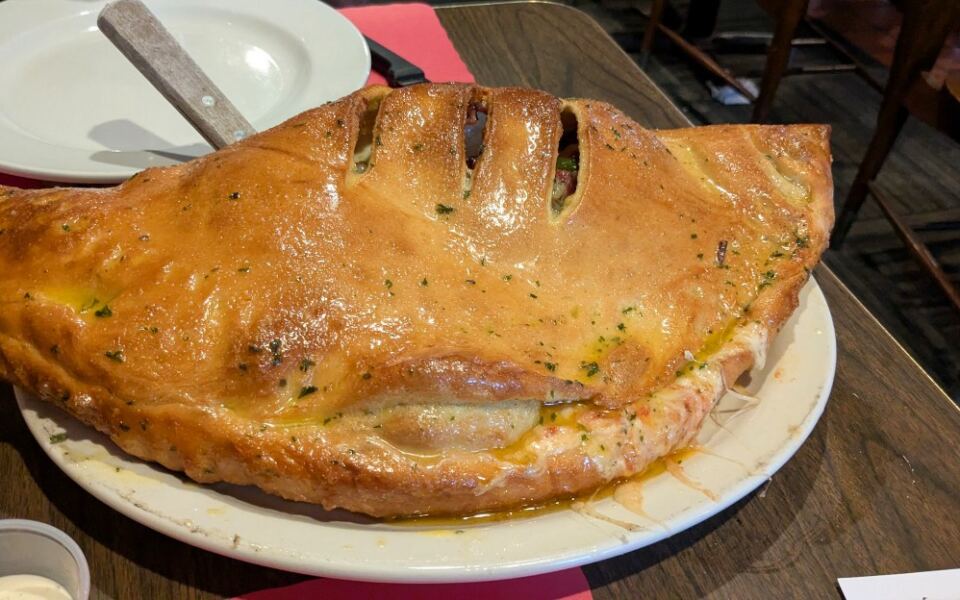 This Hidden Pittsburgh Restaurant Serves a Calzone Nearly as Wide as the Table