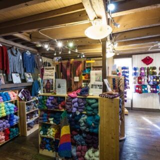 This Family-Owned Ohio Yarn Shop Stacks Skeins So High Every Knitter Finds Their Color