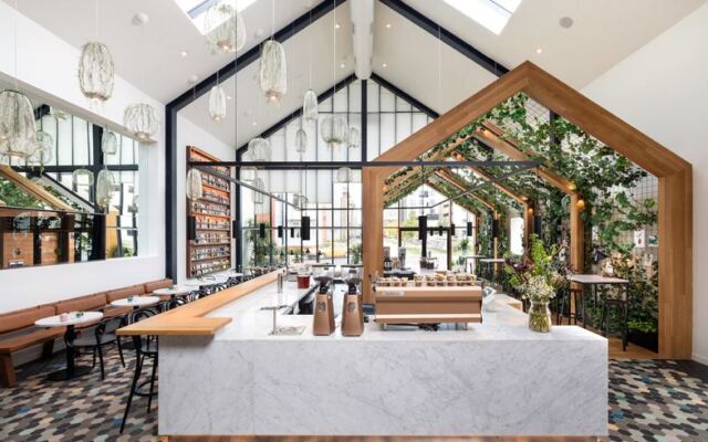 The Treehouse Inside This New Jersey Industrial Garden Turns Coffee Into a Climb