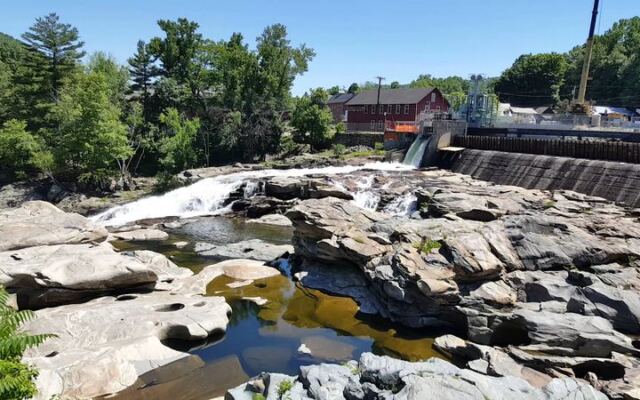 Glacial Potholes Swirl Below the Riverbank in Shelburne Falls, Massachusetts, a Free Geologic Oddity Framed by Fall Color