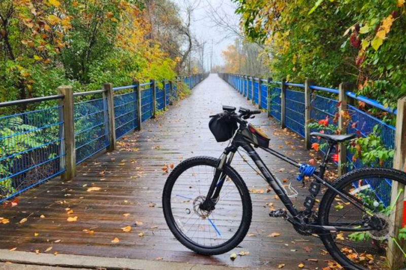This Scenic Michigan Trail Lets You Ride Past Sand Dunes, Historic Ships, and Lake Michigan Views All in One Trip