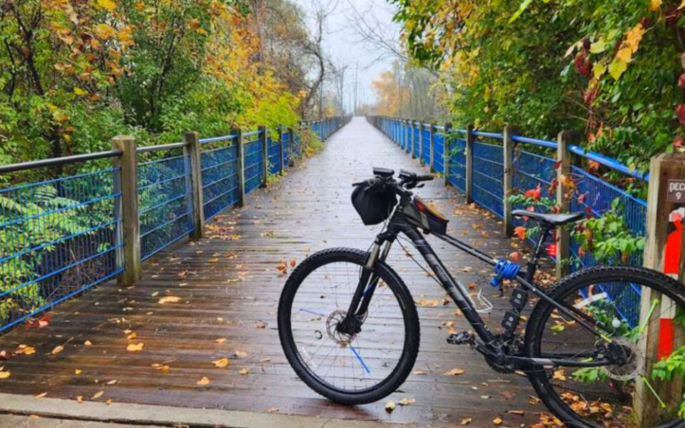 This Scenic Michigan Trail Lets You Ride Past Sand Dunes, Historic Ships, and Lake Michigan Views All in One Trip