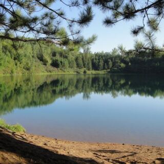 Hidden Deep in the Woods, a Minnesota Mine Pit Lake Shows Water So Clear You See the Bottom