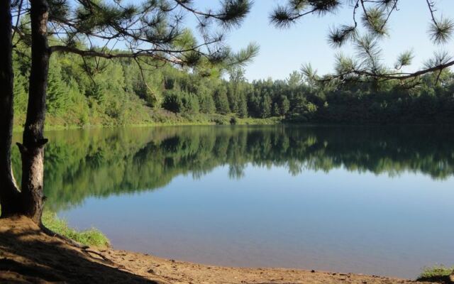 Hidden Deep in the Woods, a Minnesota Mine Pit Lake Shows Water So Clear You See the Bottom
