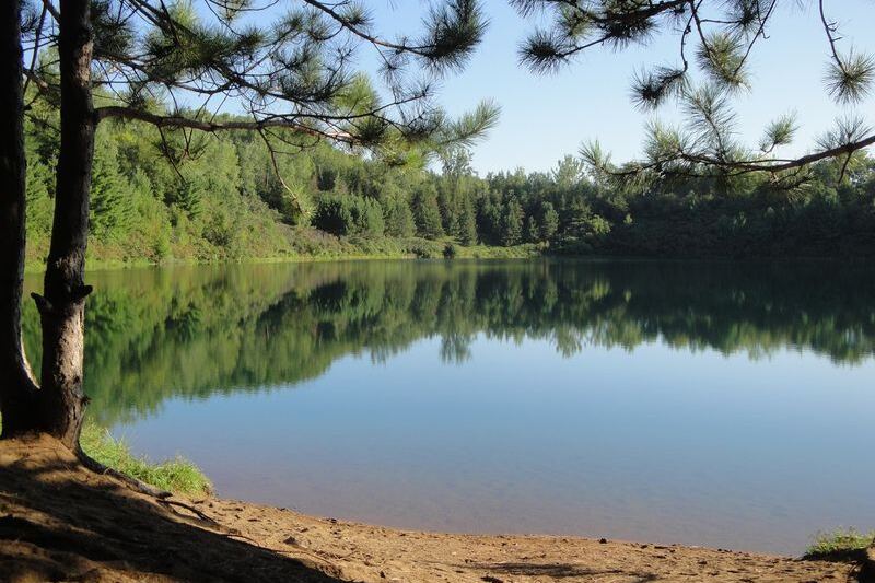Hidden Deep in the Woods, a Minnesota Mine Pit Lake Shows Water So Clear You See the Bottom