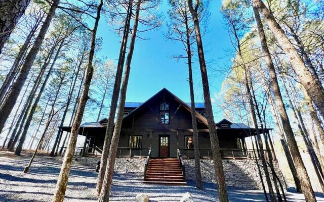 This Riverside Hideaway in Watson, Oklahoma Lets You Fish a Stocked Pond and Float the Mountain Fork