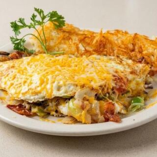 This Texas Diner Serves Its Skillet Combo In Very Large Portions With Homemade Salsa On The Side