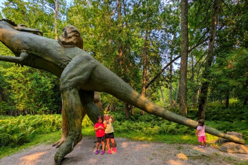 This Michigan Roadside Attraction Has Hidden Giant Dinosaurs in the Woods Since 1935