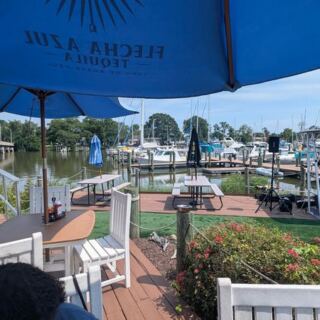 This Waterfront Sports Bar in Deale Serves Crab Cakes and Orange Crushes With Live Music by the Water