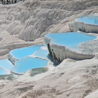 Warm Blue Pools Spill Across Snow-White Terraces at This Extraordinary Turkish Site