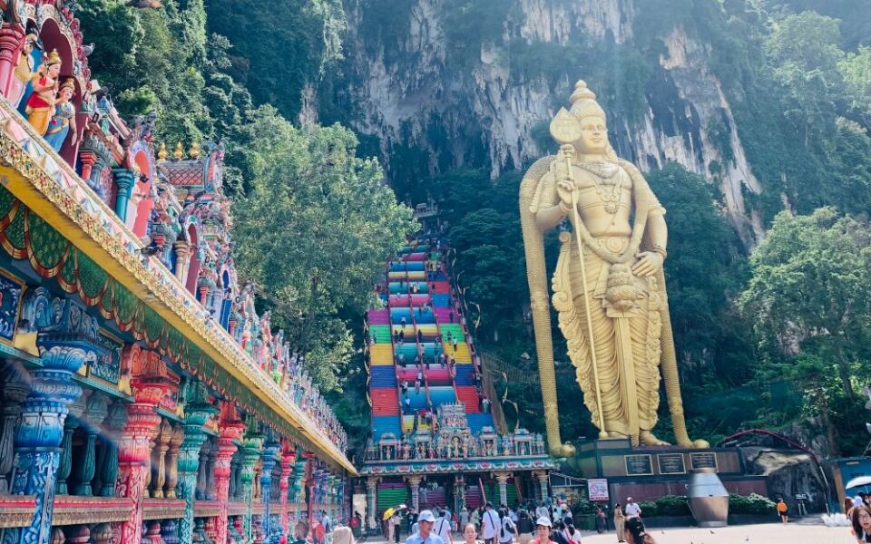 One of Malaysia’s Most Famous Sacred Sites Begins With 272 Colorful Steps Beneath a Giant Golden Statue